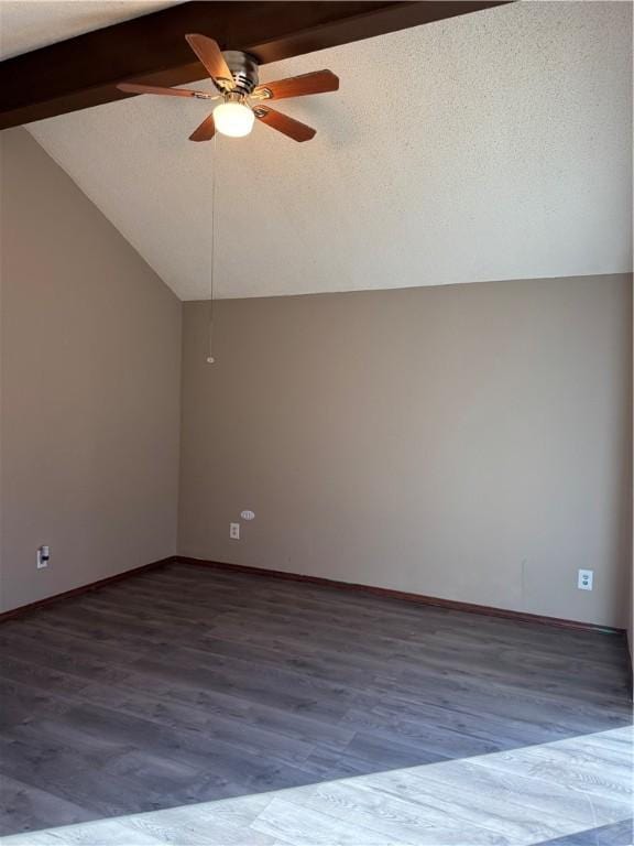 unfurnished room featuring vaulted ceiling with beams, hardwood / wood-style floors, and ceiling fan