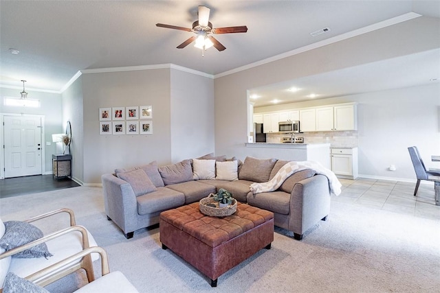 living room with crown molding and ceiling fan