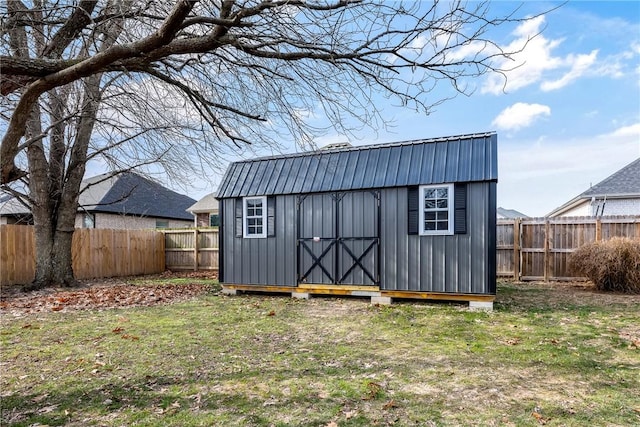 view of outbuilding featuring a yard