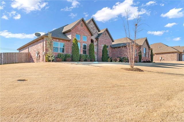 front facade with a front yard