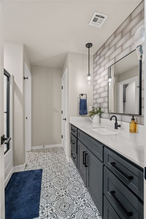 bathroom with vanity and shower / washtub combination