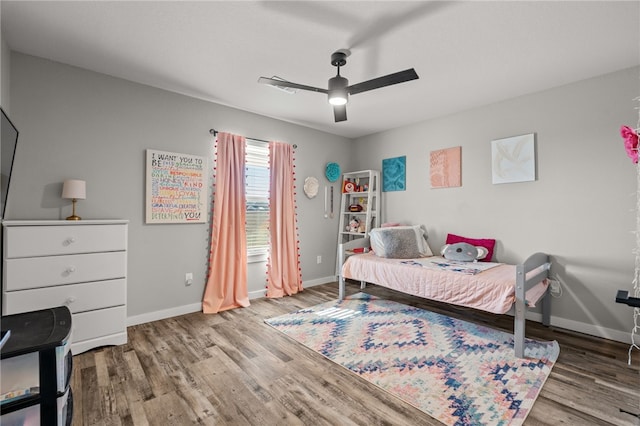 bedroom with hardwood / wood-style flooring and ceiling fan