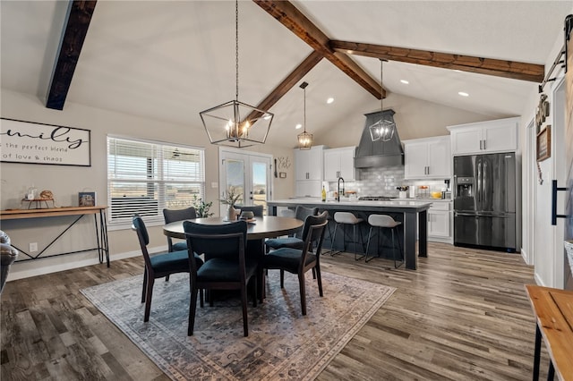 dining area with high vaulted ceiling, sink, dark wood-type flooring, beam ceiling, and french doors