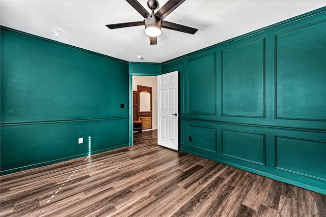 unfurnished bedroom featuring dark wood-type flooring and ceiling fan