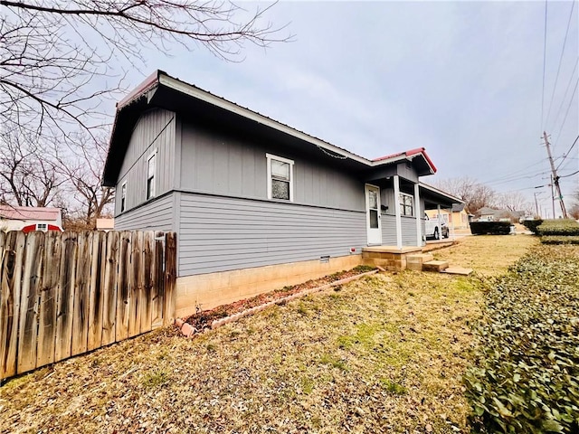 view of home's exterior with a yard