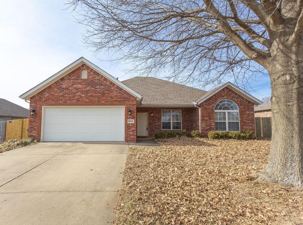 single story home with a garage