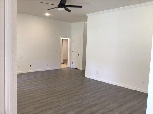 empty room featuring dark wood-type flooring, ceiling fan, and ornamental molding