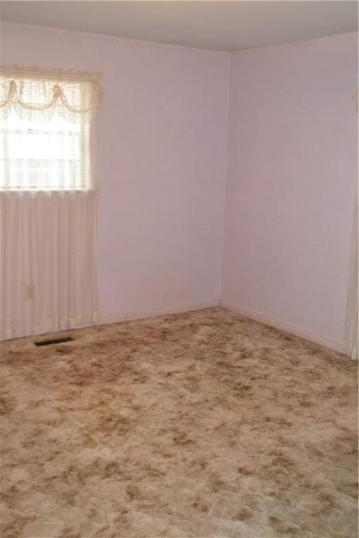 empty room featuring carpet floors