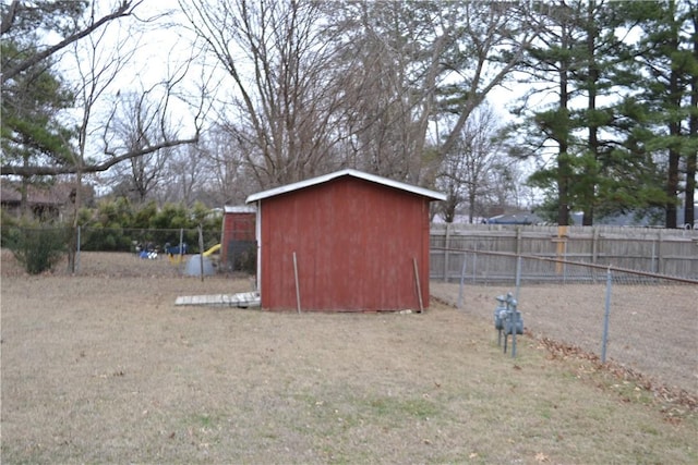 view of outbuilding with a lawn