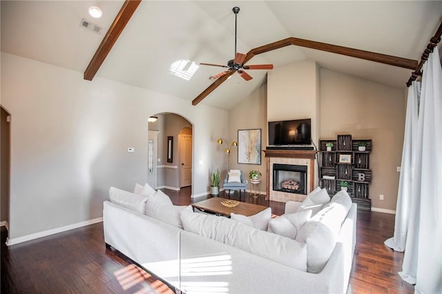 living room featuring beam ceiling, high vaulted ceiling, dark hardwood / wood-style floors, and ceiling fan