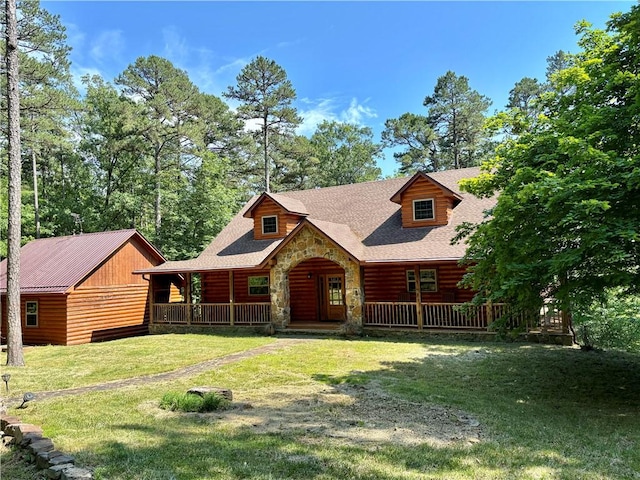 log-style house featuring a front yard and covered porch