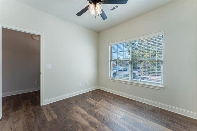 unfurnished room featuring dark hardwood / wood-style floors and ceiling fan