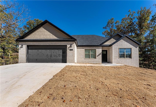 view of front of house with a garage and a front yard