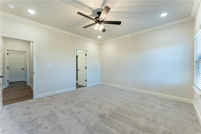 unfurnished bedroom with crown molding, carpet floors, and ceiling fan