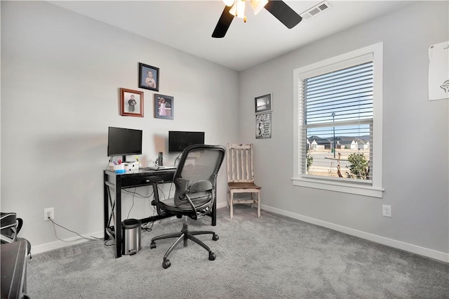 office space with ceiling fan and light colored carpet