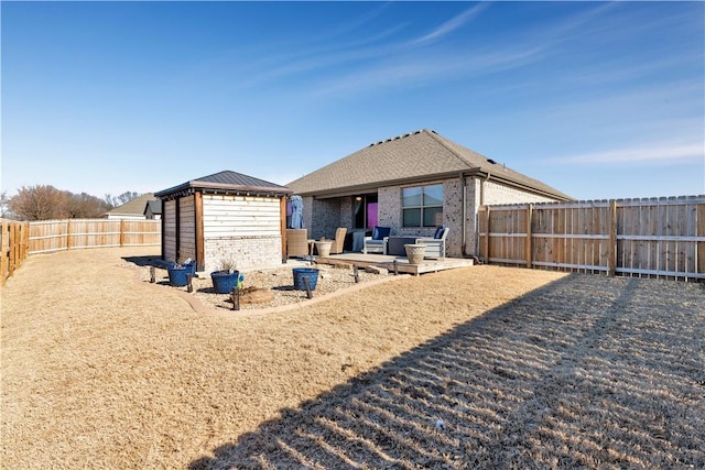 rear view of property featuring a gazebo and a patio