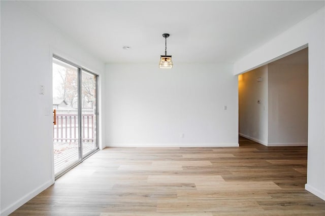 spare room with light wood-type flooring