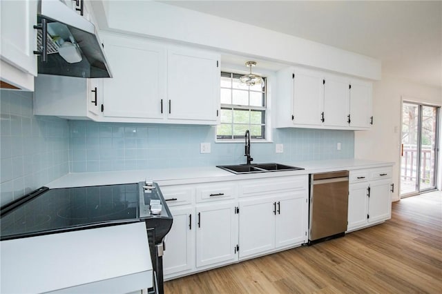 kitchen featuring sink, white cabinetry, light hardwood / wood-style flooring, electric range, and decorative backsplash