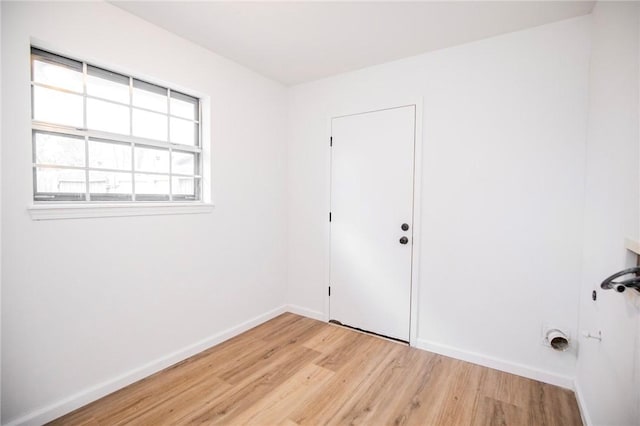 empty room with light hardwood / wood-style flooring