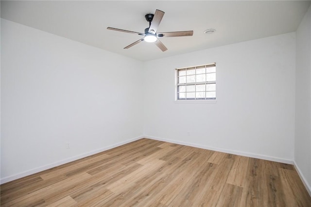 spare room featuring ceiling fan and light wood-type flooring