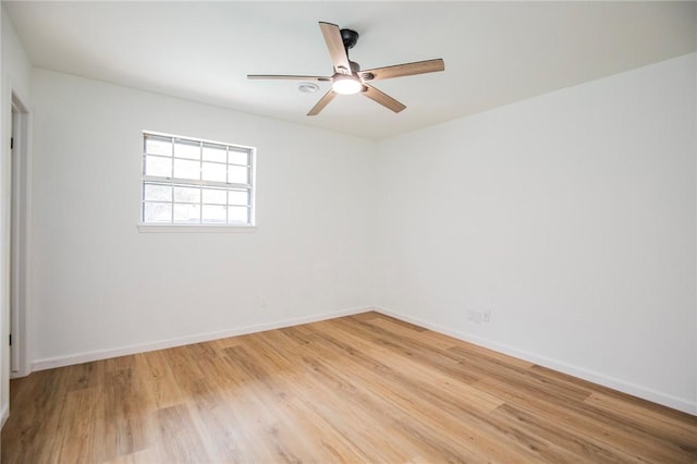 spare room featuring ceiling fan and light wood-type flooring