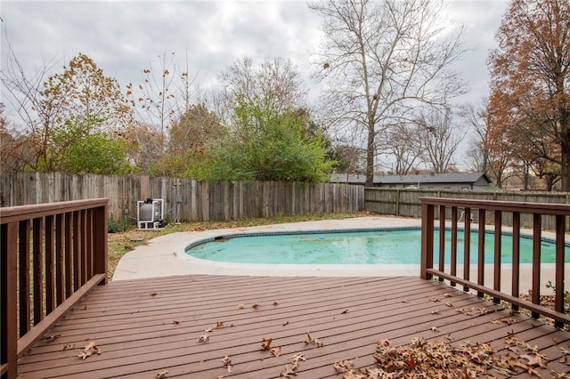 view of swimming pool with a wooden deck