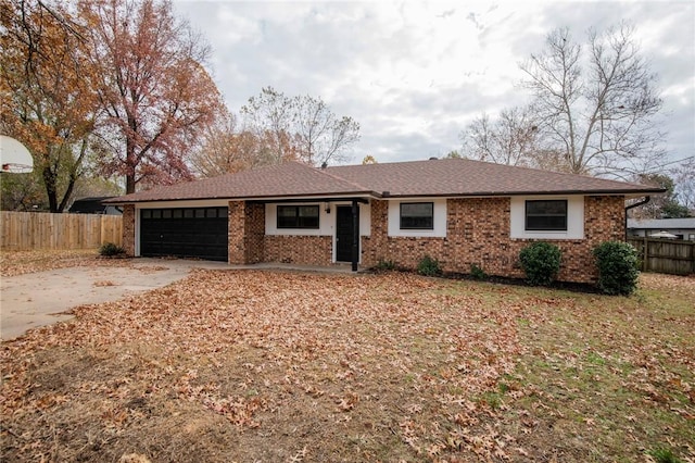 ranch-style house featuring a garage