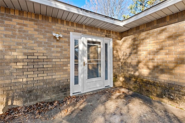 entrance to property with a patio