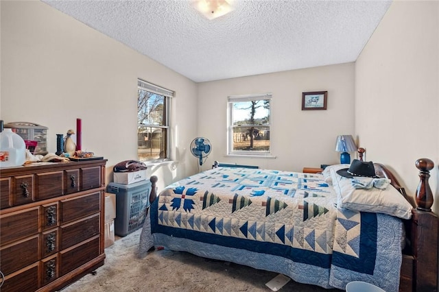 carpeted bedroom with a textured ceiling