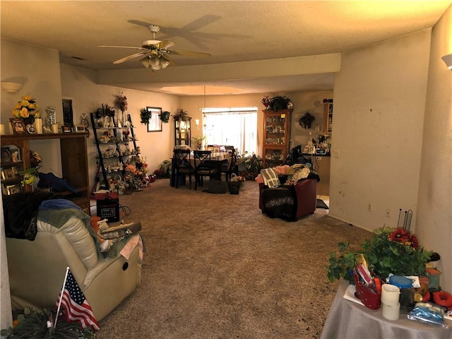 carpeted living room with ceiling fan