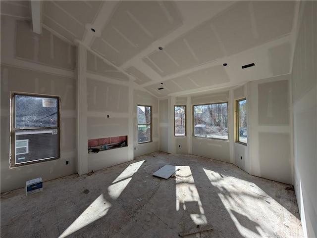 unfurnished living room with lofted ceiling