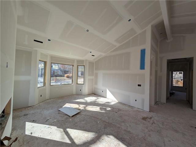 spare room featuring vaulted ceiling