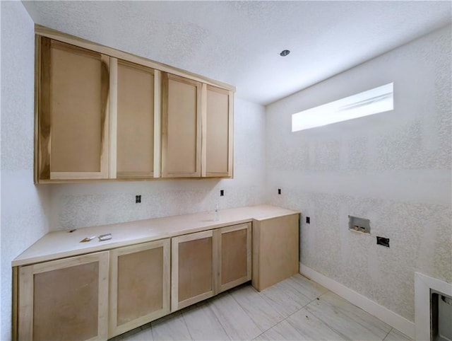 17 Burnham Dr, Bella Vista, AR 72715 - laundry room with cabinet space, washer hookup, hookup for an electric dryer, and baseboards