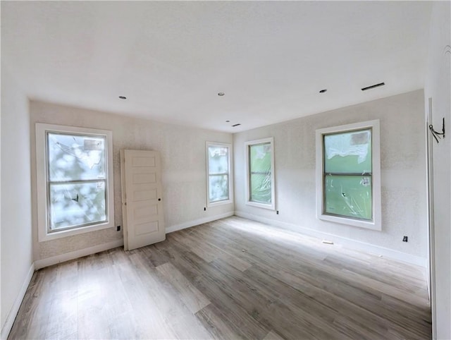 17 Burnham Dr, Bella Vista, AR 72715 - spare room featuring baseboards and wood finished floors