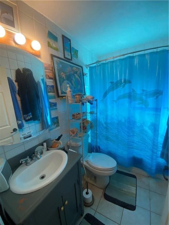 1312 S 9th St, Rogers, AR 72756 - full bathroom with a shower with shower curtain, vanity, toilet, backsplash, and tile patterned flooring
