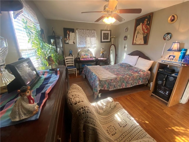 1312 S 9th St, Rogers, AR 72756 - bedroom with wood finished floors and a ceiling fan