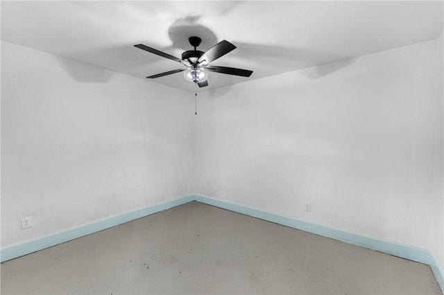 empty room with concrete flooring and ceiling fan