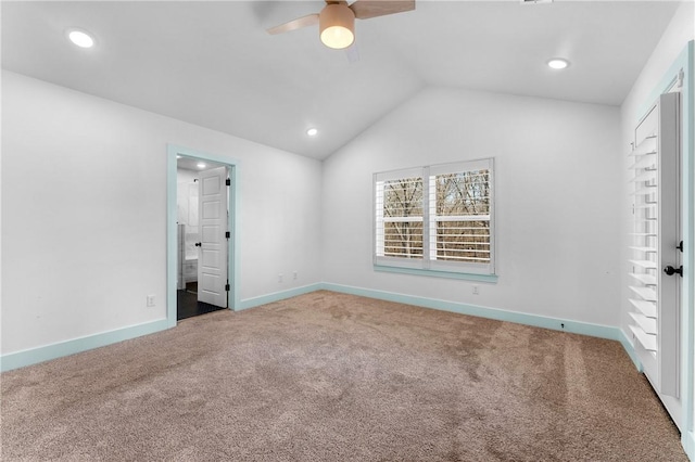 unfurnished bedroom featuring lofted ceiling, carpet floors, ceiling fan, and ensuite bathroom