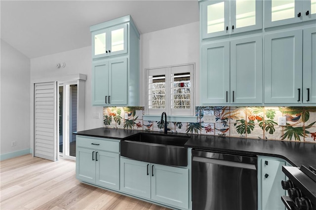 kitchen with tasteful backsplash, sink, stainless steel dishwasher, and light wood-type flooring