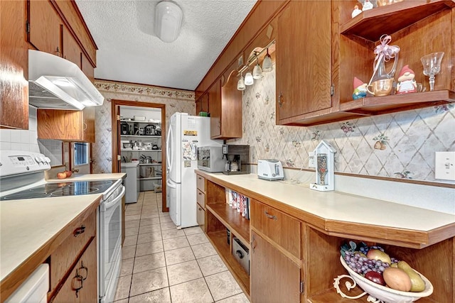 kitchen with ventilation hood, decorative backsplash, light tile patterned floors, white appliances, and a textured ceiling