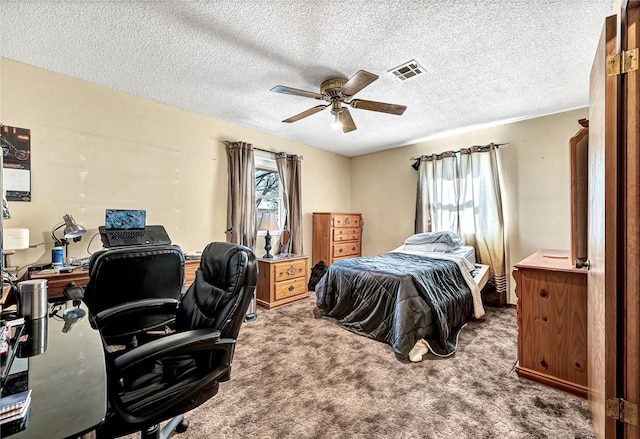 carpeted bedroom with multiple windows, a textured ceiling, and ceiling fan