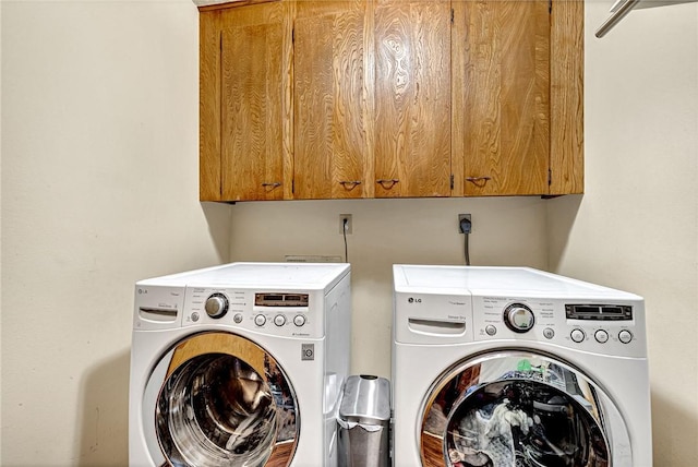 laundry area featuring cabinets and independent washer and dryer