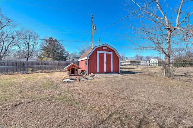 view of outbuilding featuring a yard