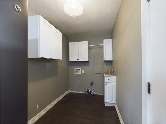 washroom with washer hookup, cabinets, hookup for a gas dryer, and dark hardwood / wood-style floors