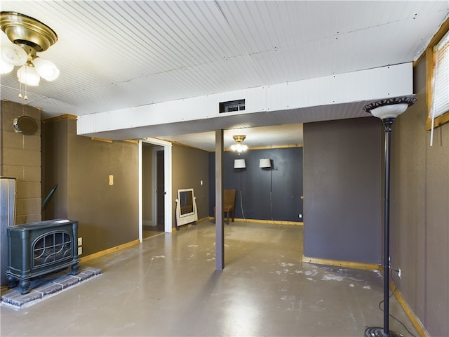 basement featuring a wood stove