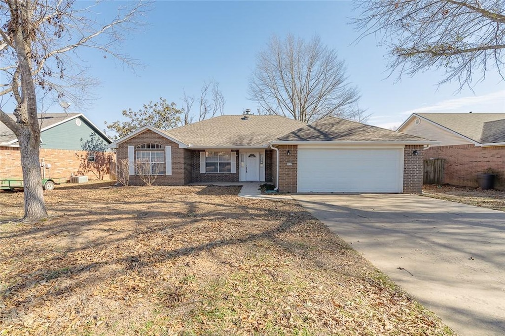 ranch-style home featuring a garage