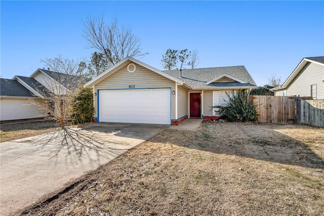 ranch-style home featuring a garage