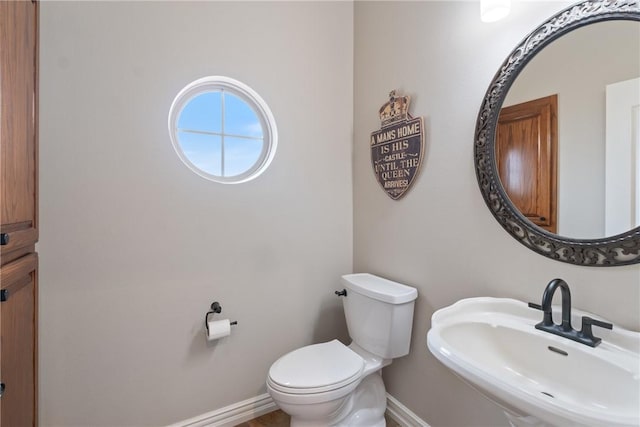 bathroom with toilet and sink