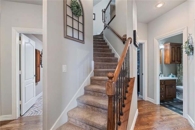 stairway featuring wood-type flooring