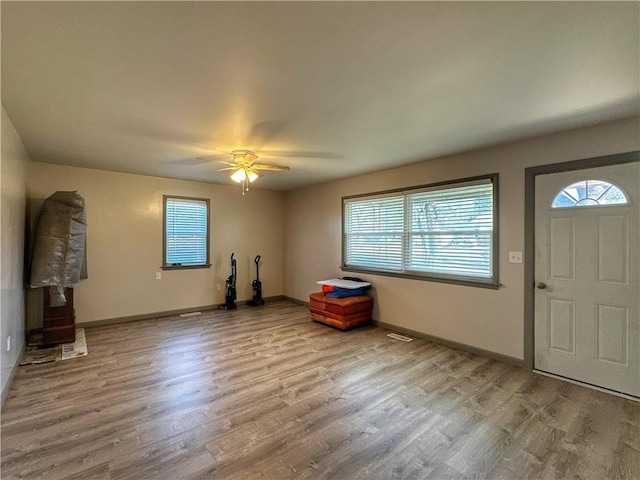 foyer featuring ceiling fan and light hardwood / wood-style flooring